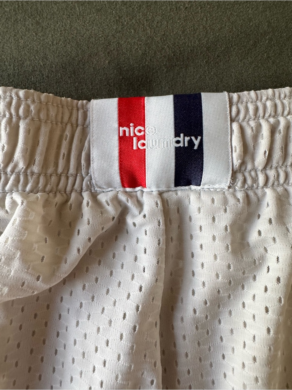 Nice Laundry - White Mesh Athletic Shorts Red, Navy, and white logo.